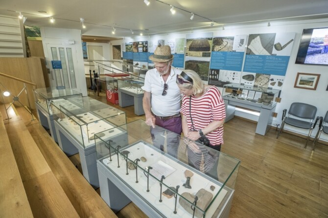 Couple looking at exhibition in Carlow Museum Copy