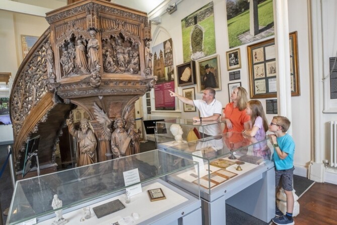 Family looking at church monument at Carlow Museum Copy Family looking at church monument at Carlow Museum Copy