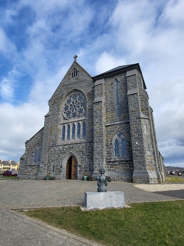 Mary Young in front of the church she funded min min min 1