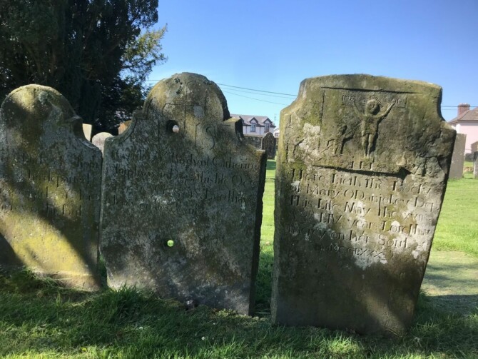 Selection of headstones Note the holes within the middle headstone Something which is still a mystery to locals optimized 400 Selection of headstones Note the holes within the middle headstone Something which is still a mystery to locals optimized 400